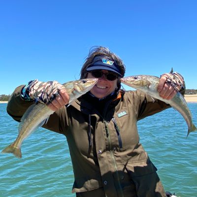 Steve Starlo's Wife with her latest King Whiting Catch in Ridgeline rain jacket